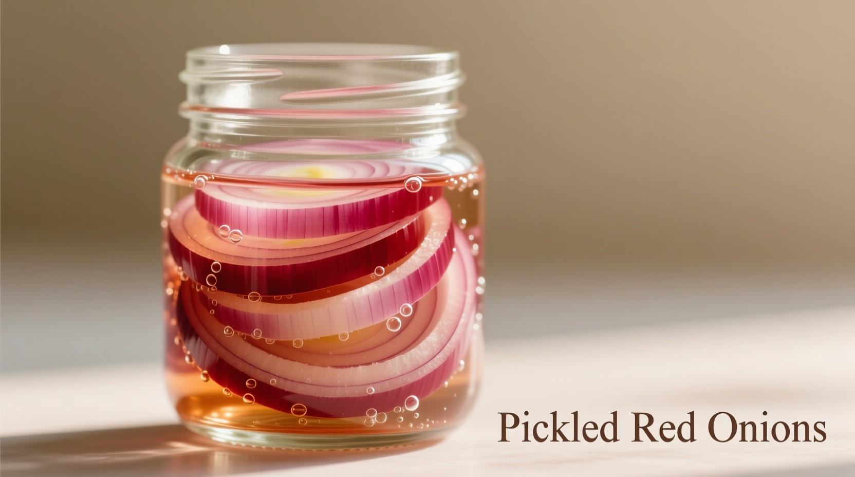 Thinly sliced red onions in mason jar with vinegar solution