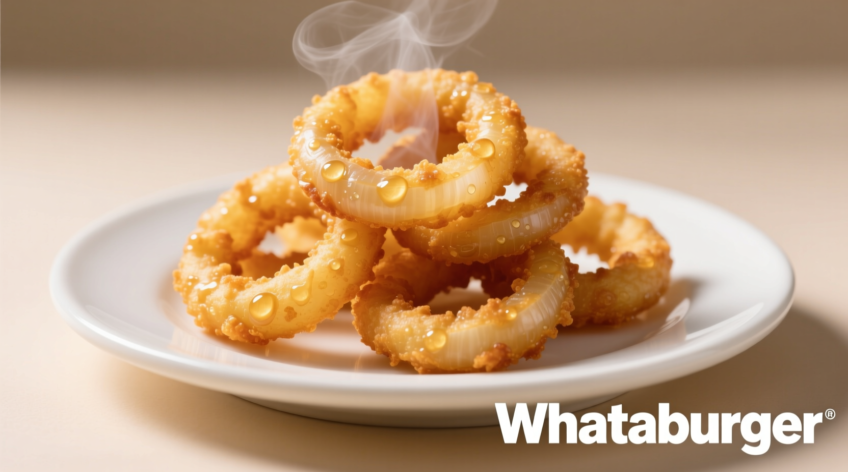 Freshly fried Whataburger onion rings on white plate