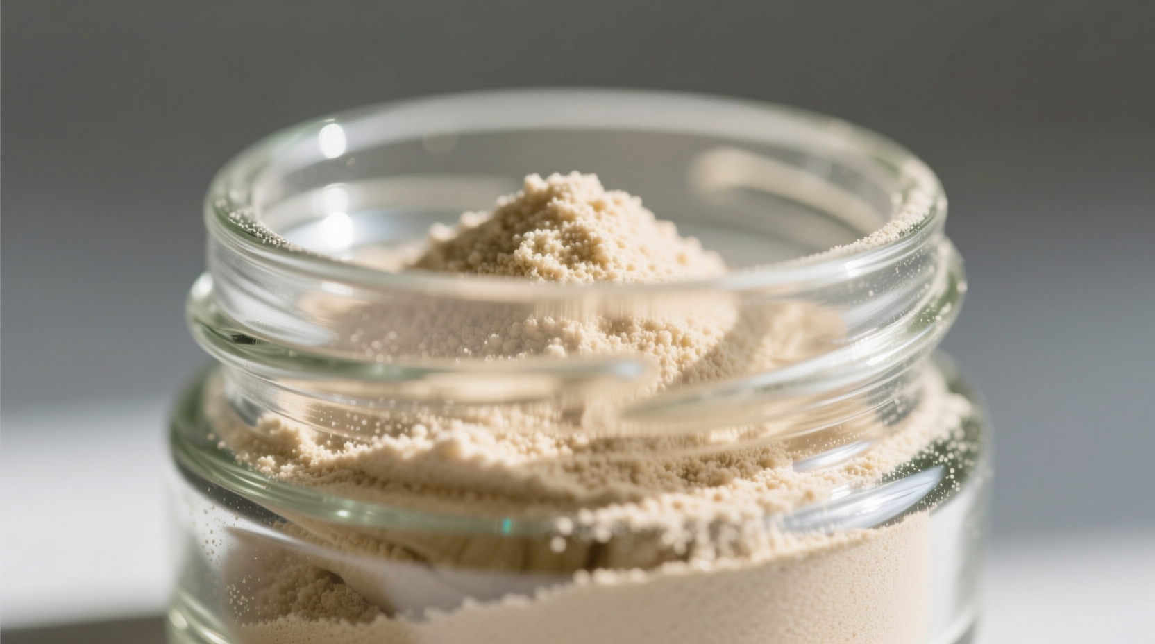 Close-up of garlic scape powder in glass jar