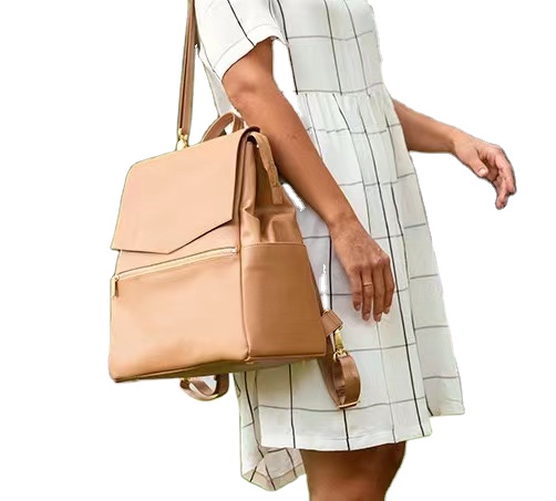 Convertible baby diaper nappy bag made of vegan leather with large capacity and stroller straps