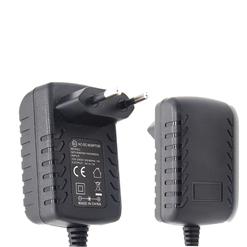 По всему миру Unverisail вилки AC DC 9V 1A 1000mA портативный зарядное устройство с Au US EU UK KR интерфейс