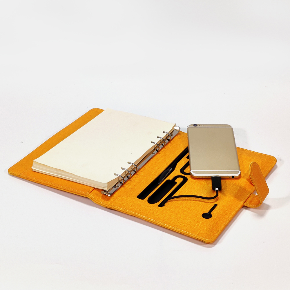 Wholesale Hardcover Large PU Leather Custom Matt Yellow Embossed Travel Charging Printed Notebook with Silver Edge Glide