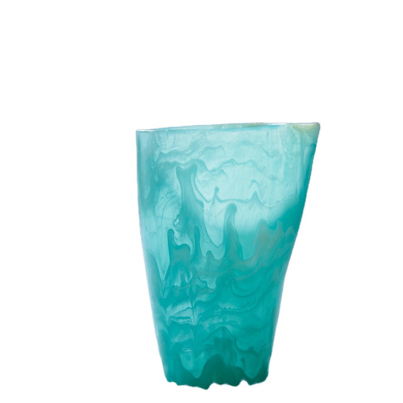 Unique handmade resin cup with aqua swirl and marble effect which is able to contain water and ice cream