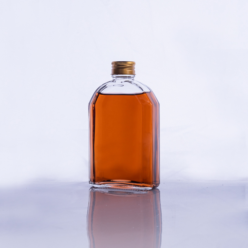 Wholesale a variety of capacity clear colour empty liquor bottles with cap