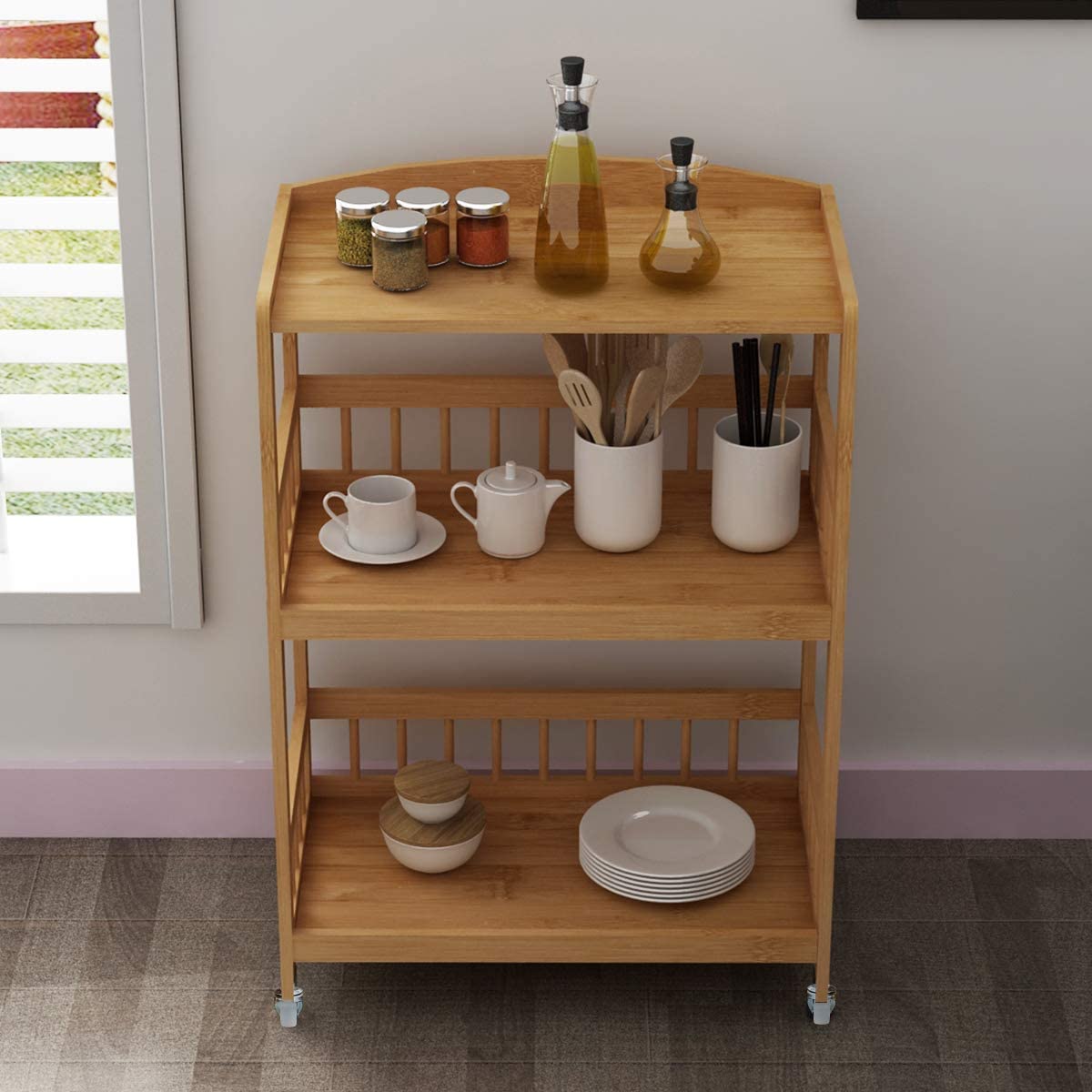 Three-layer portable kitchen trolley on wheels is durable and can be used for parties, restaurants, hotels