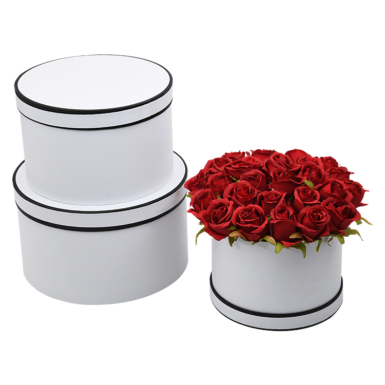 Characteristic round set of three flowers gift box holding bucket