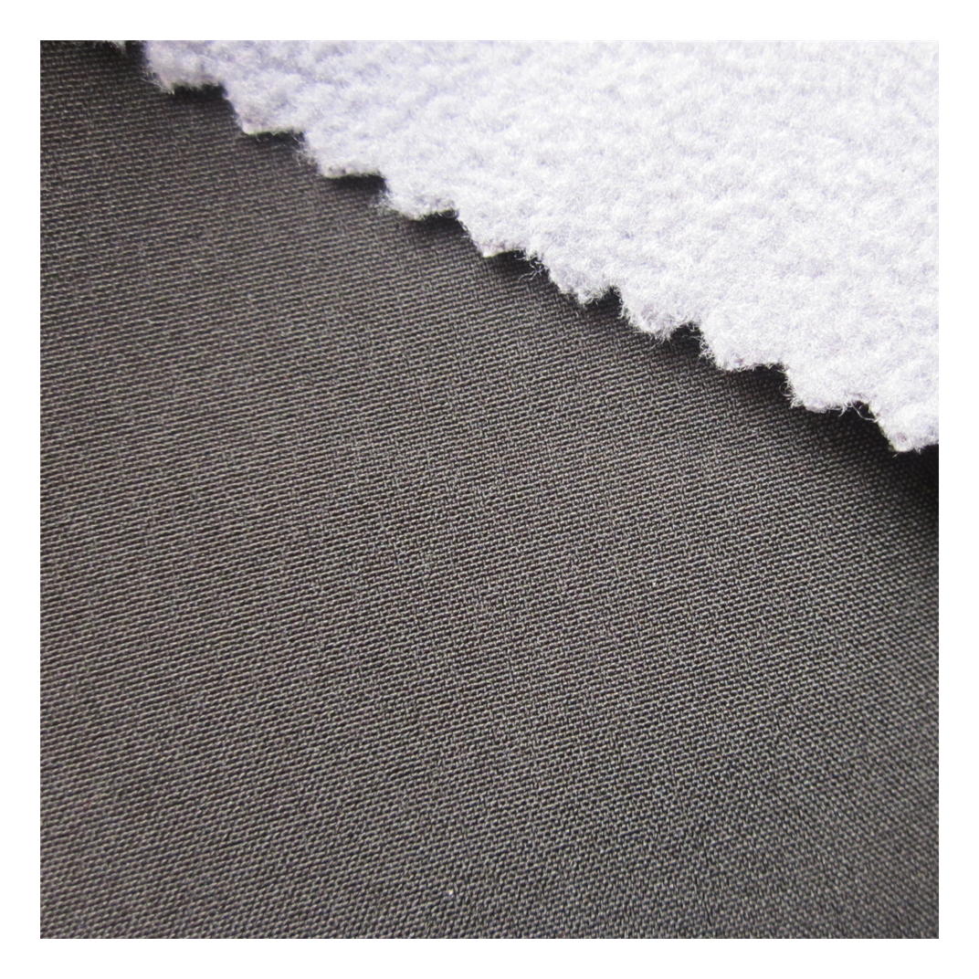 Waterproof softshell four way stretch polyester spandex fabric bonded with weft knit fabric