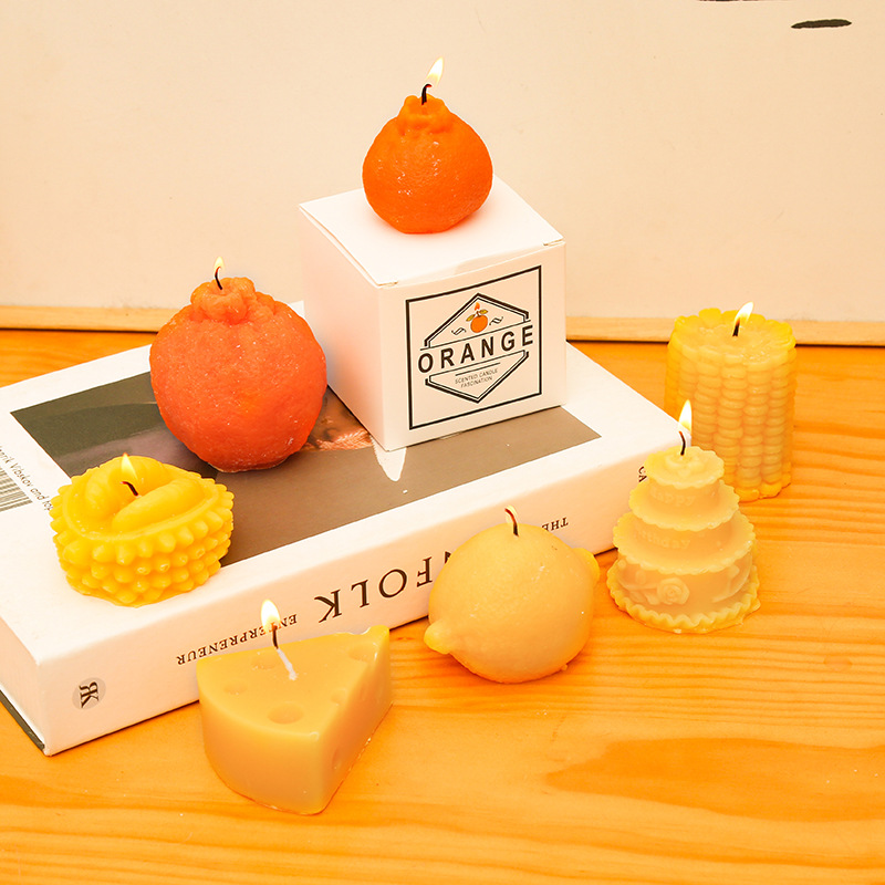 New Fruit Shape Aromatherapy Candles Hot Sale Custom Photo Props Ugly Orange With Hand Gift Lemon Cheese Soy Wax Scented Candle/