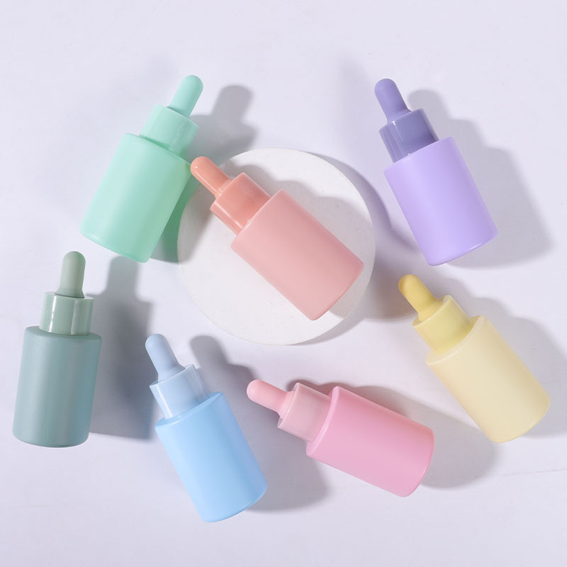 Stock pink colored glass 30ml essential oil bottles for women