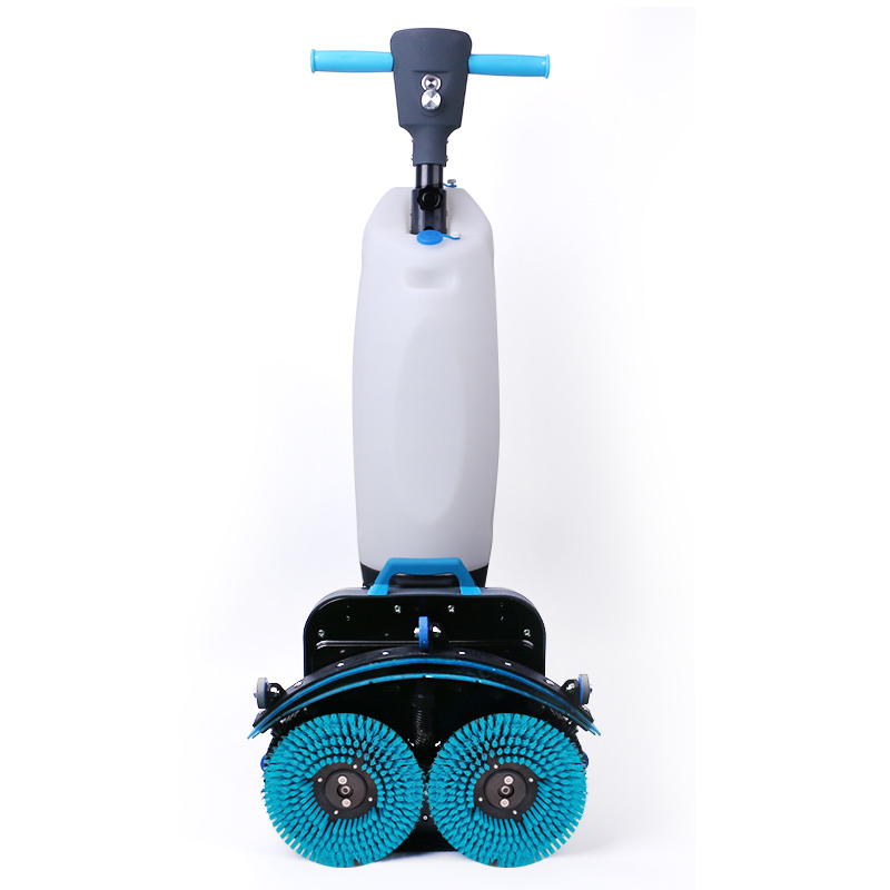 Compact walk-behind floor scrubbing or cleaning machine with folding handle