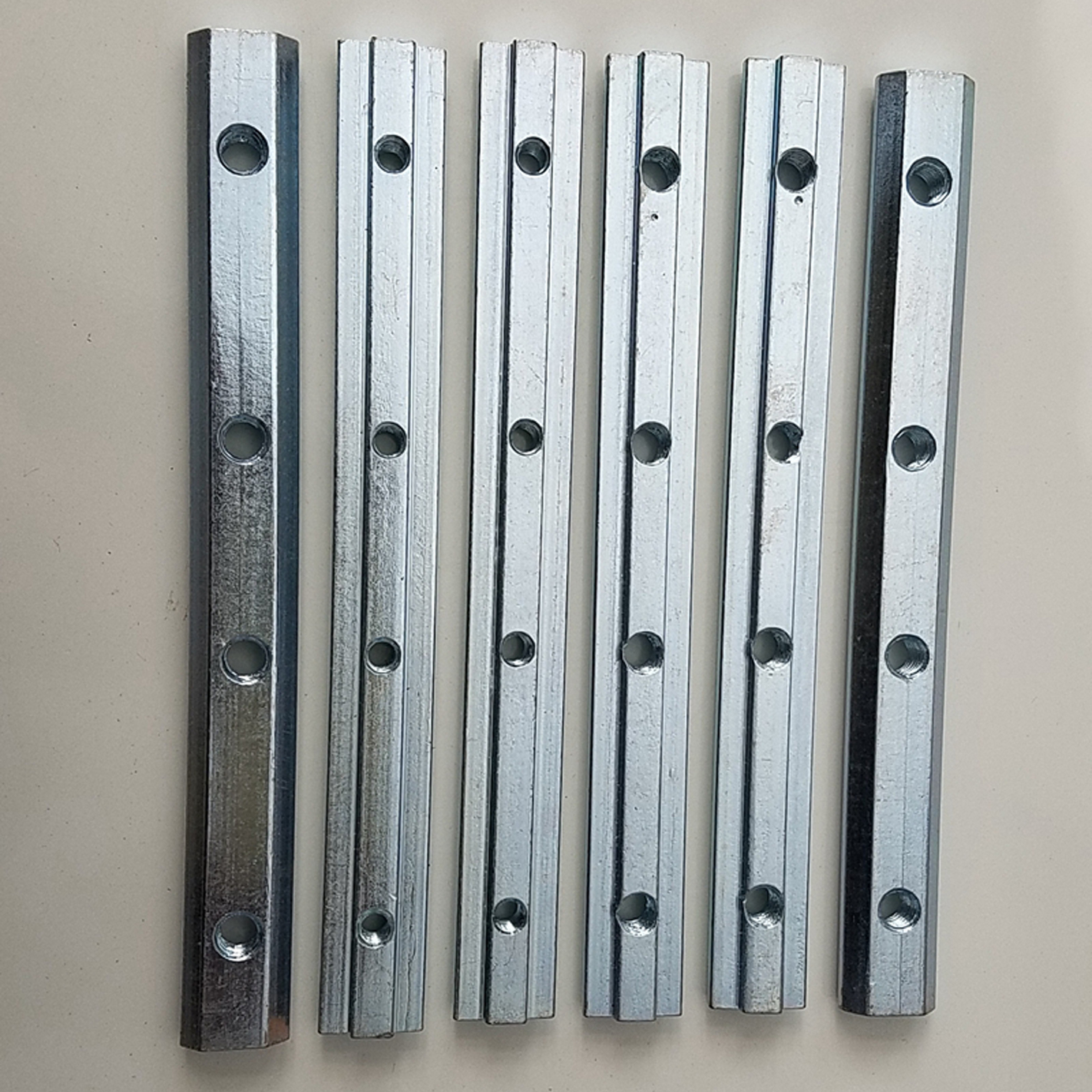 Wholesale White Zinc Carbon Steel Long T-Slot Nut T Slot 180 Degree Connector 4 Hole Steel Machine Fastener