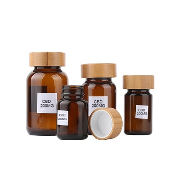 Новое поступление антилегкие бутылки Cbd упаковка фармацевтическое стекло янтарные банки с бамбуковой крышкой