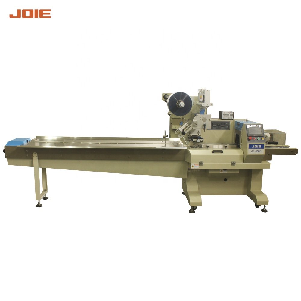 Automatic flow wrapper meat packaging machine