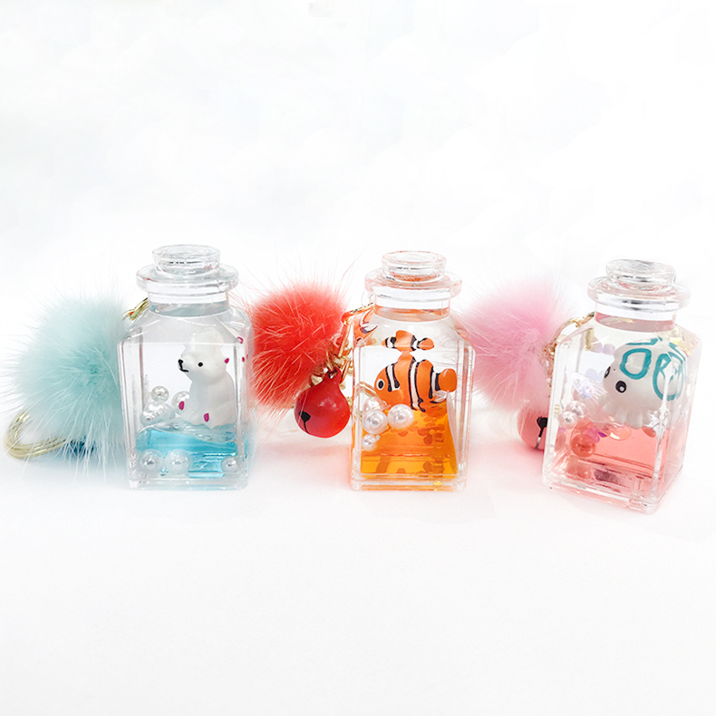 ESL Liquid Oil Marine Style Floating Doll Ladies Car Keychain Pendant