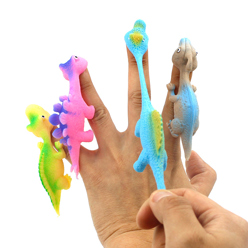 Hot Sale TPR Material High Quality Promotion TPR Dinosaur Toy Slingshot Catapult Toys Small Children Toys