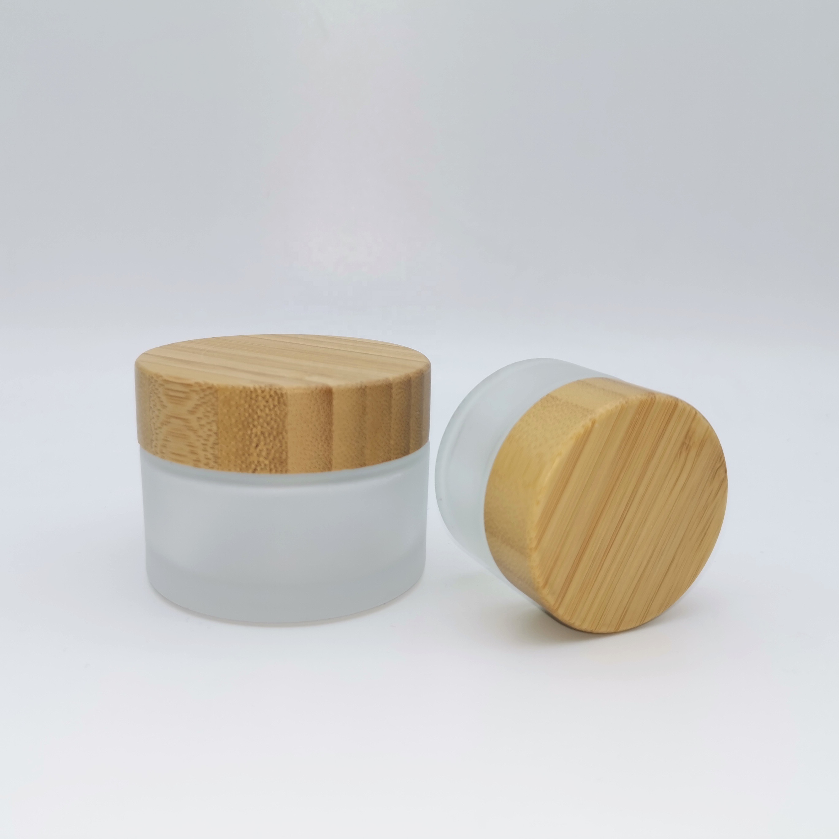 Factory price cosmetic containers frosted cream glass jar with bamboo lid