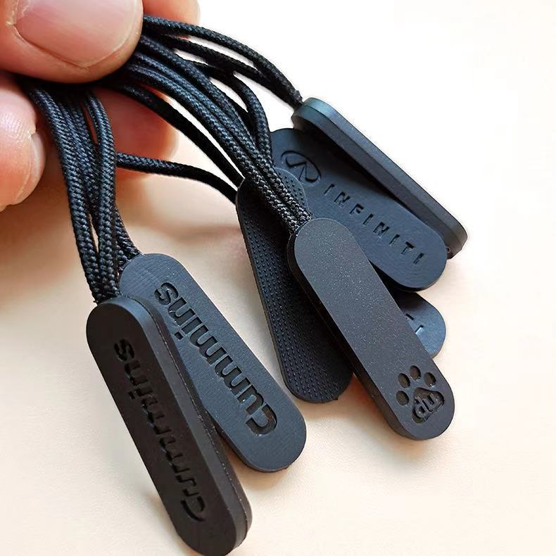 NX-0026 Hot Sale Custom PVC plastic drawstring zipper puller clothing manufacturers supply PVC injection puller rope loop pull