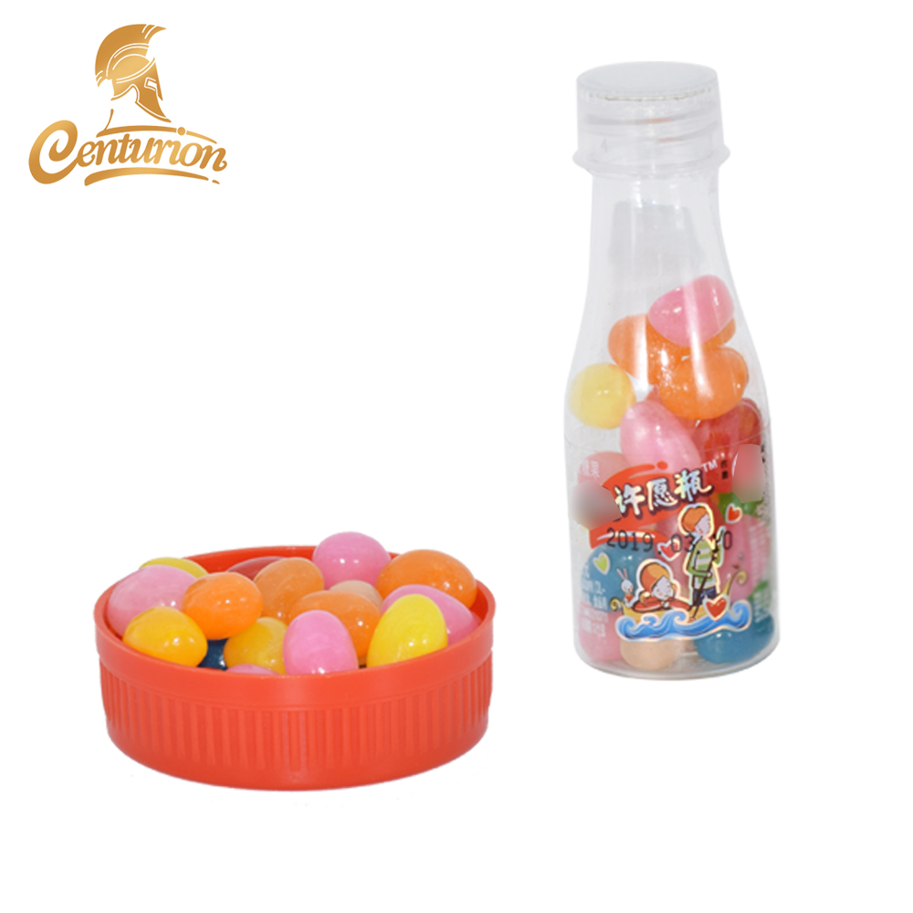 Yellow sweet soft sour jelly candy beans in bottle