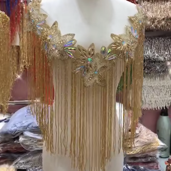 Золотистый декоративный болеро с бахромой и кисточками от haute couture