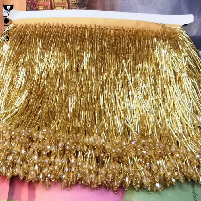 Hot sell fashion bling bling hand sew on ribbon long trim gold beaded fringe trimming for evening wear