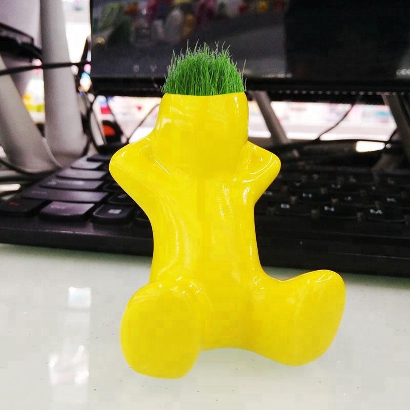 Grass doll little white man growing grass head