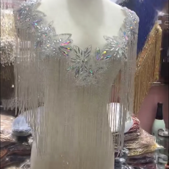 Модное декоративное серебряное болеро из бусин с кисточками от haute couture