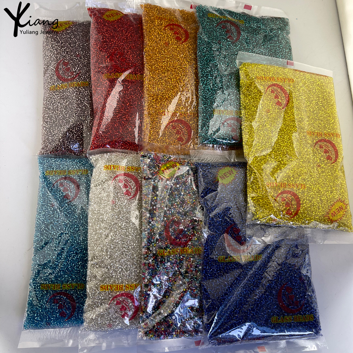 Wholesale 2mm glass filled silver rice beads at actual price for DIY bracelets, necklaces, and clothing materials