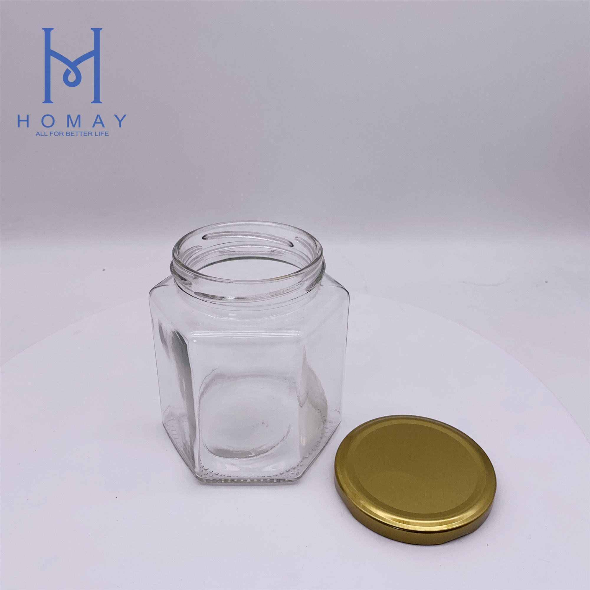 Фабрика продажи 500ml шестиугольная стеклянная банка для хранения еды с крышкой