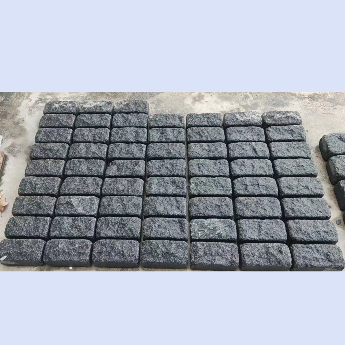 Modern outdoor cobblestone pavers naturally roll down Chinese black stone black granite