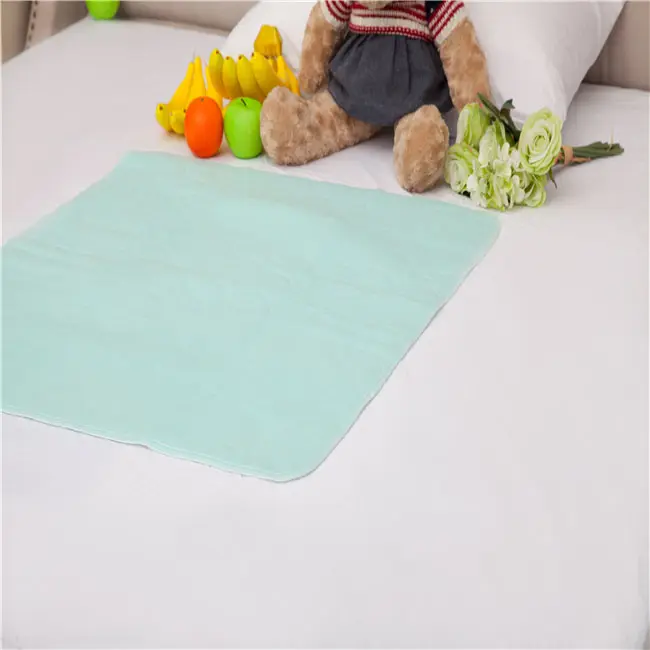 Four layers waterproof tricot bed pad