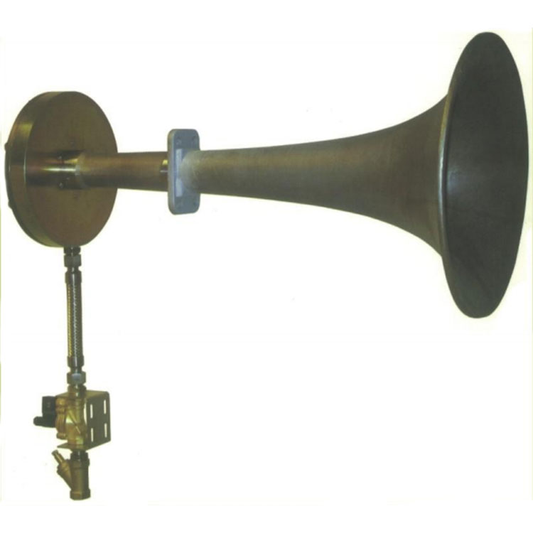 Low frequency sonic soot blower for heat exchanger