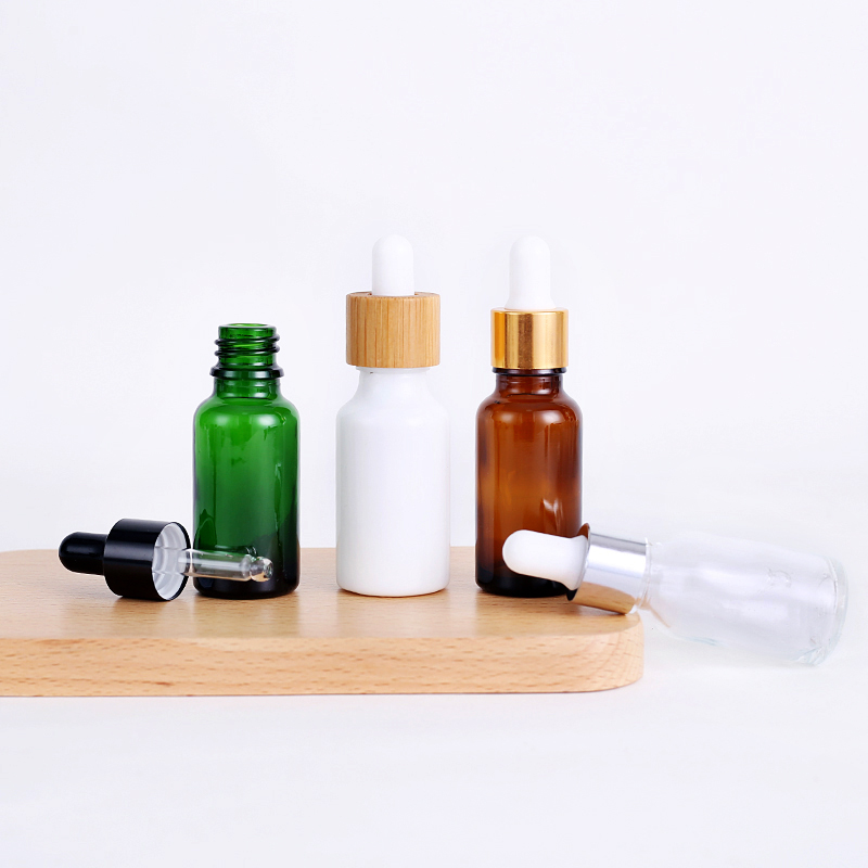 Matte essential oil dropper bottle 100ml 10ml 15ml 30ml white black amber frosted glass dropper bottle with bamboo aluminum cap