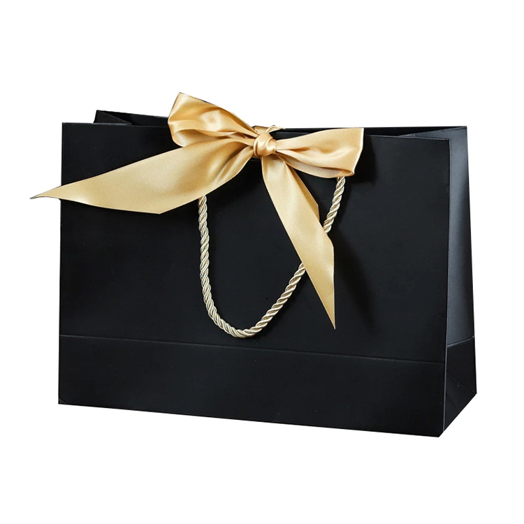 Wholesale luxury shopping gift paper bags design custom small ribbon decoration paper favor gift bag with handle