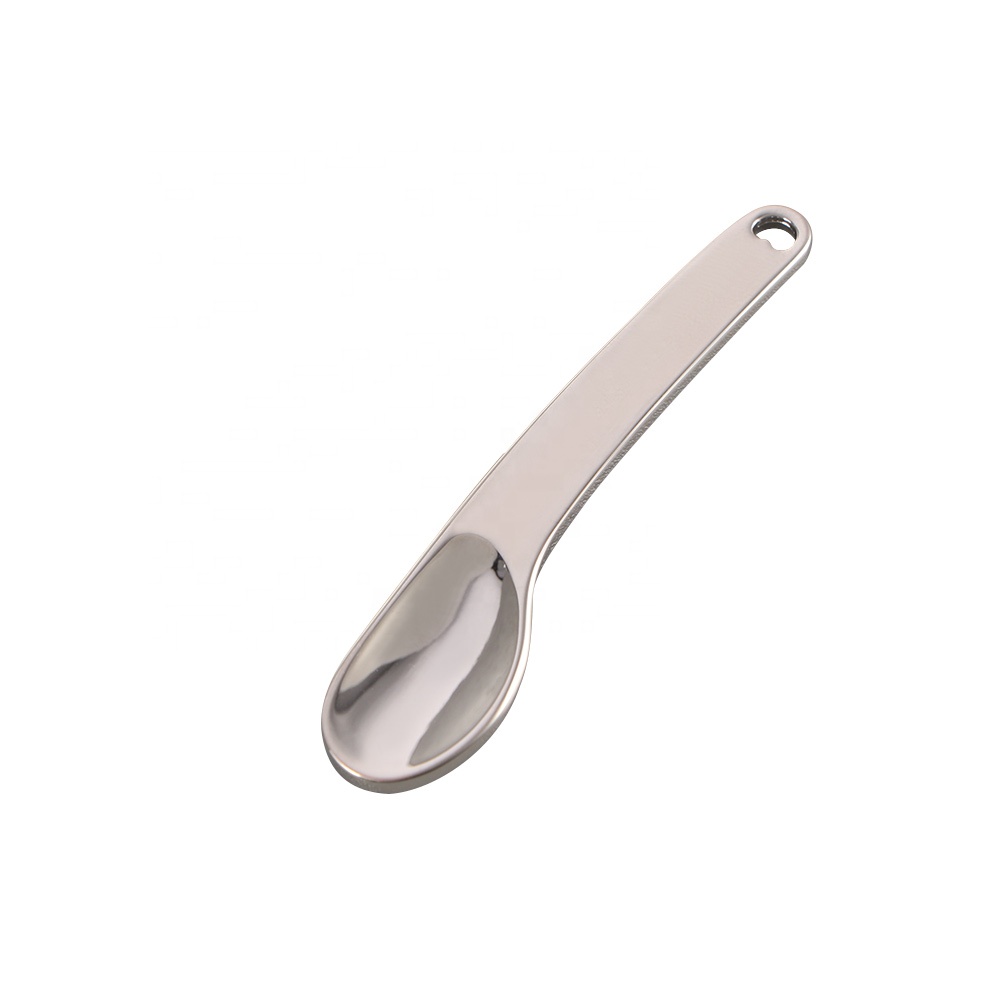 Eye massage cream cosmetic silver metal spoon and spatula