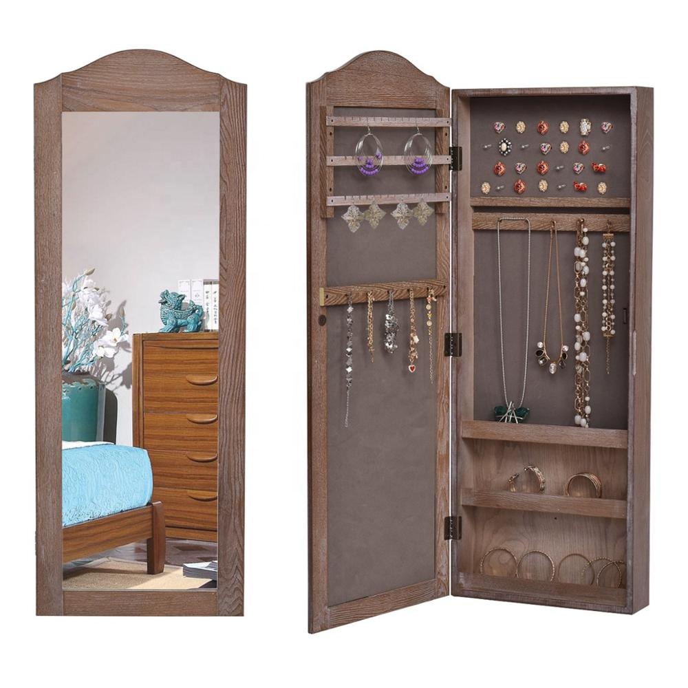brown bedroom with mirror jewelry cabinet