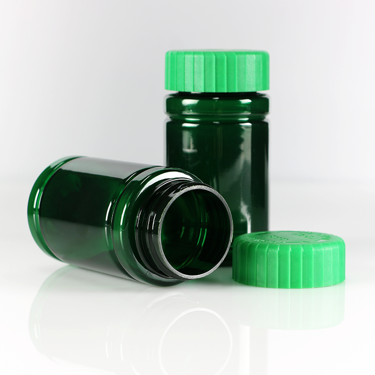 tablet pill filling counting bottling machine using green color plastic capsule pill round empty shaped bottle