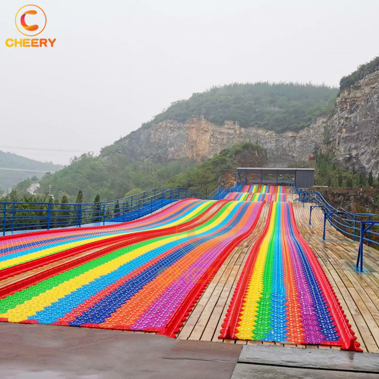 New product outdoor playground amusement games children grass sliding way Rainbow dry snow slide for sale