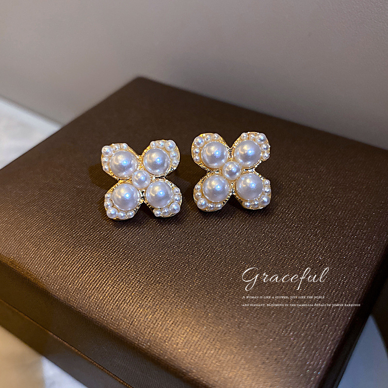 Jewelry 925 silver needle advanced light luxury French Pearl Earrings four Petal Flower net red temperament Design