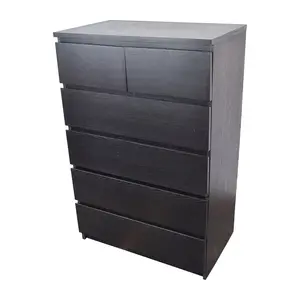 Tall black dresser with two small and four large drawers
