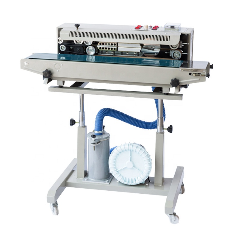 Vacuum nitrogen continuous automatic sealing machine for snacks.