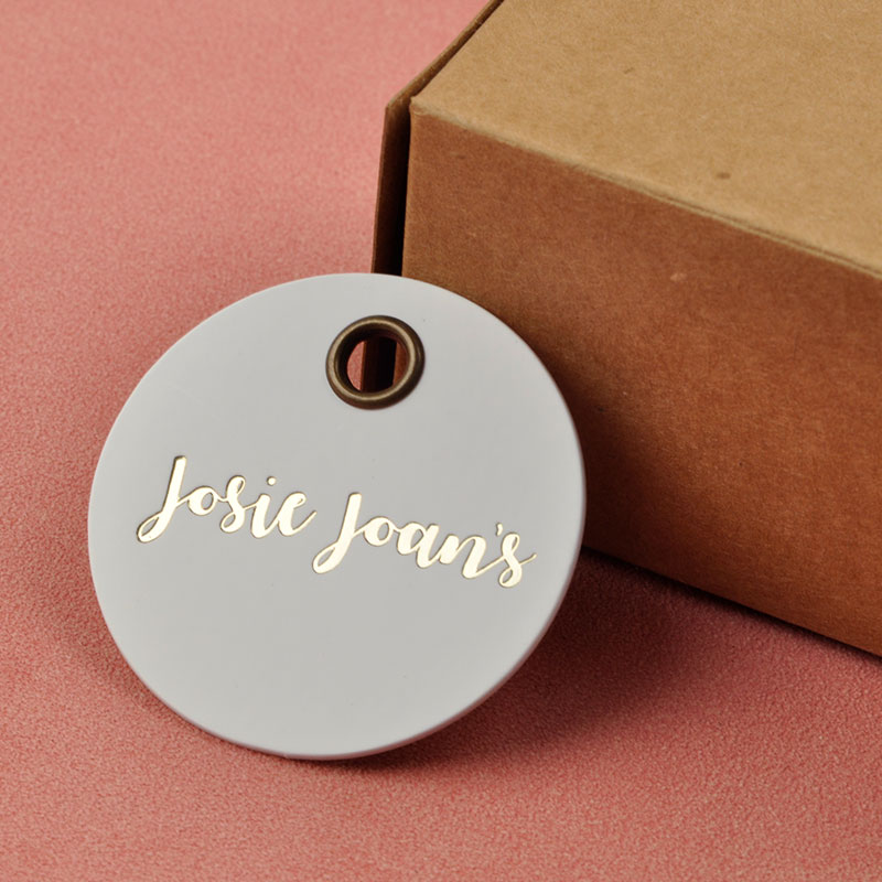 Reusable round high-level hang tags with gold stamping and metal eyelet