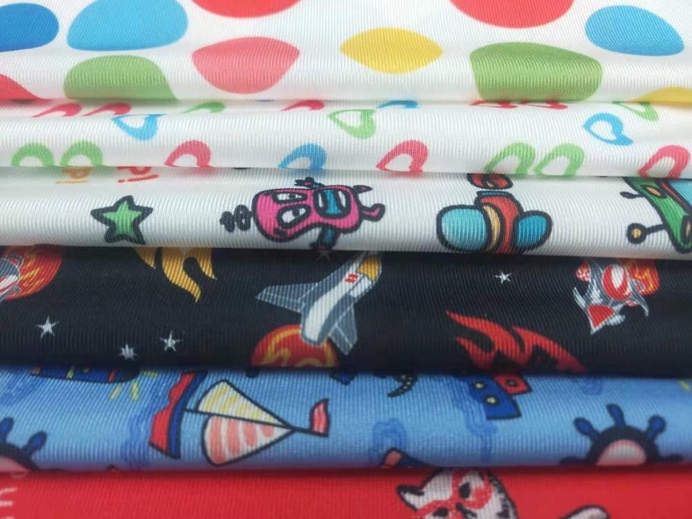 Shaoxing textile custom polyester spandex stretch warp knitted fabric with fashion transfer print for swimwear