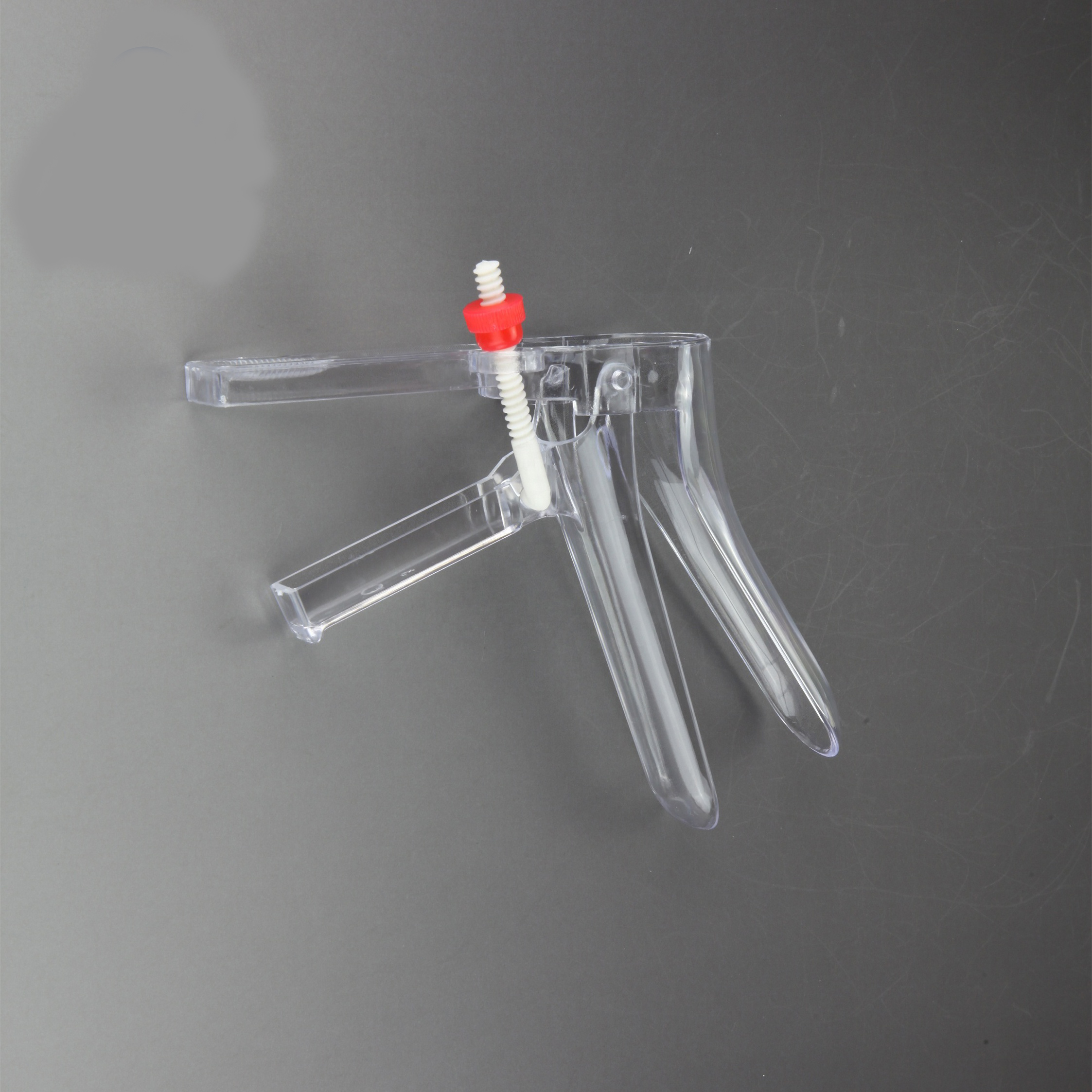 Disposable sterile vaginal speculum side screw