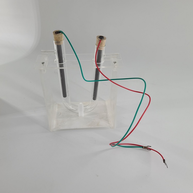 High school U-shaped tube with carbon rod and graphite branch demonstrator for electrolytic copper chloride solution