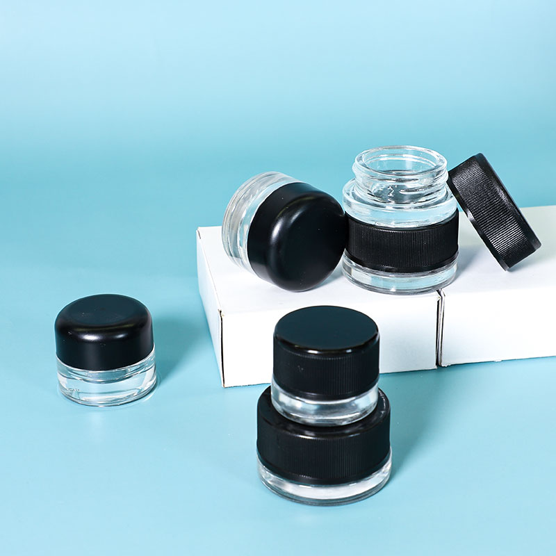 UKETA wholesale odorless childproof portable 3ml 5ml mini weed glass storage jar with black lid