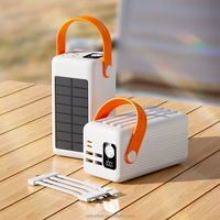 Power Bank Darurat Outdoor Putih 200000mAh 22.5W dengan 4 Kabel Terintegrasi, Senter LED, Pegangan Jinjing, dan Colokan & Penyangga