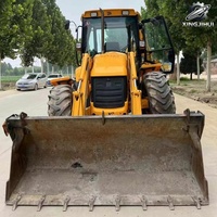 Chargeuse sur pneus JCB 4CX d'occasion, 8,6 tonnes, godet de 1 m, marque britannique d'origine, certifiée CE, avec moteur.