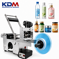 Machine d'étiquetage semi-automatique pour bouteilles rondes KDM-SL50 pour les contenants alimentaires, les boissons, les cosmétiques et les produits de santé