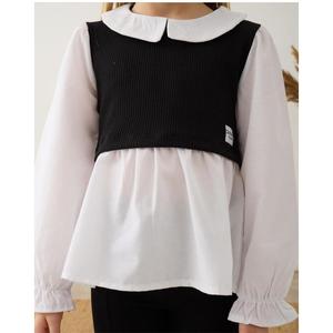 Camicia nera da ragazza dettagliata in alto e in basso