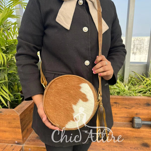 Chic Western Inspired Hair-on-Hide Leather Canteen Bag Premium Quality Fur Leather Circular <b>Sling</b> with Tassel & Zipper Closure - Product Image 1